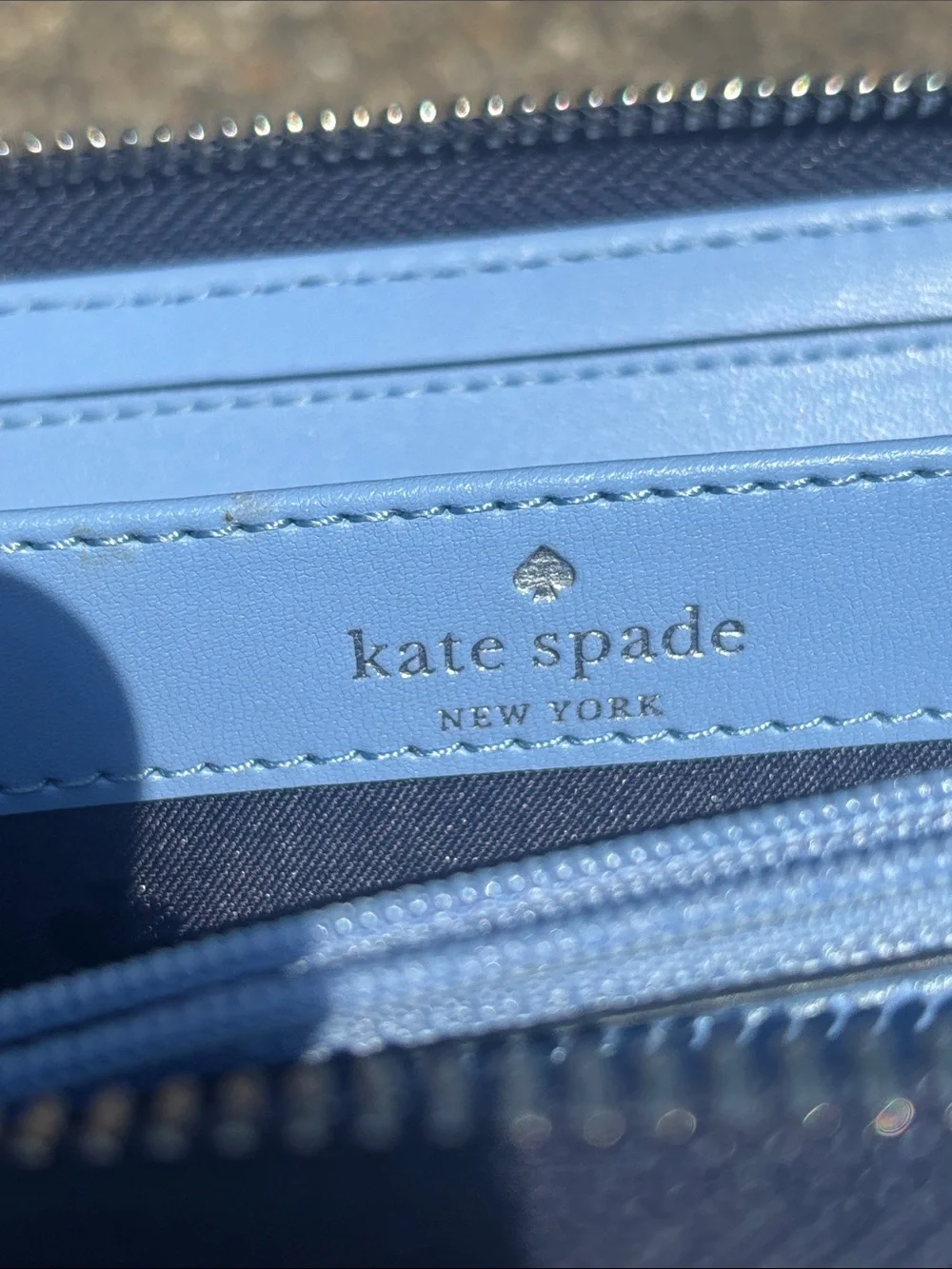 kate spade light blue and navy zip-around wallet